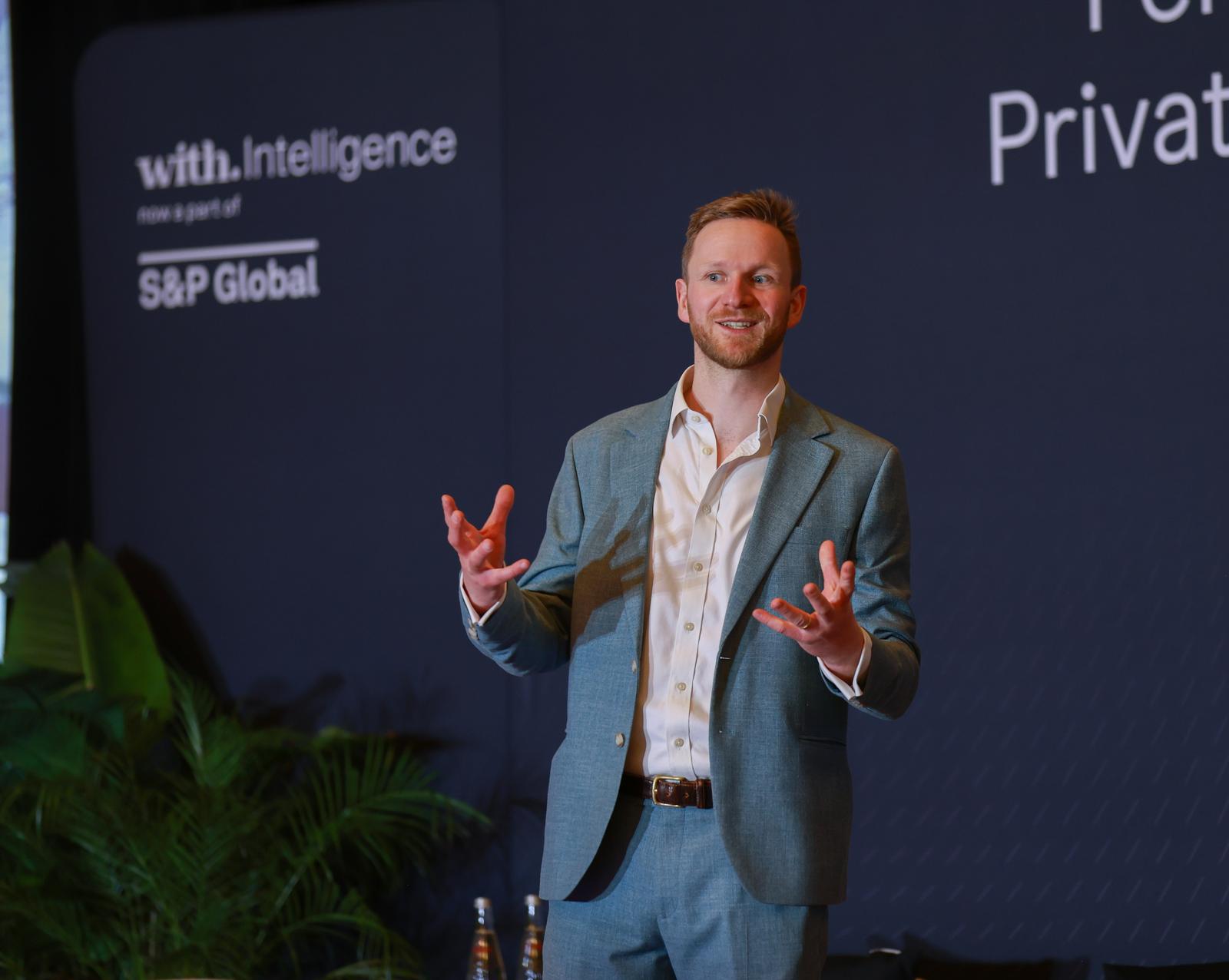Mark Agnew delivering a change management keynote at a With Intelligence conference